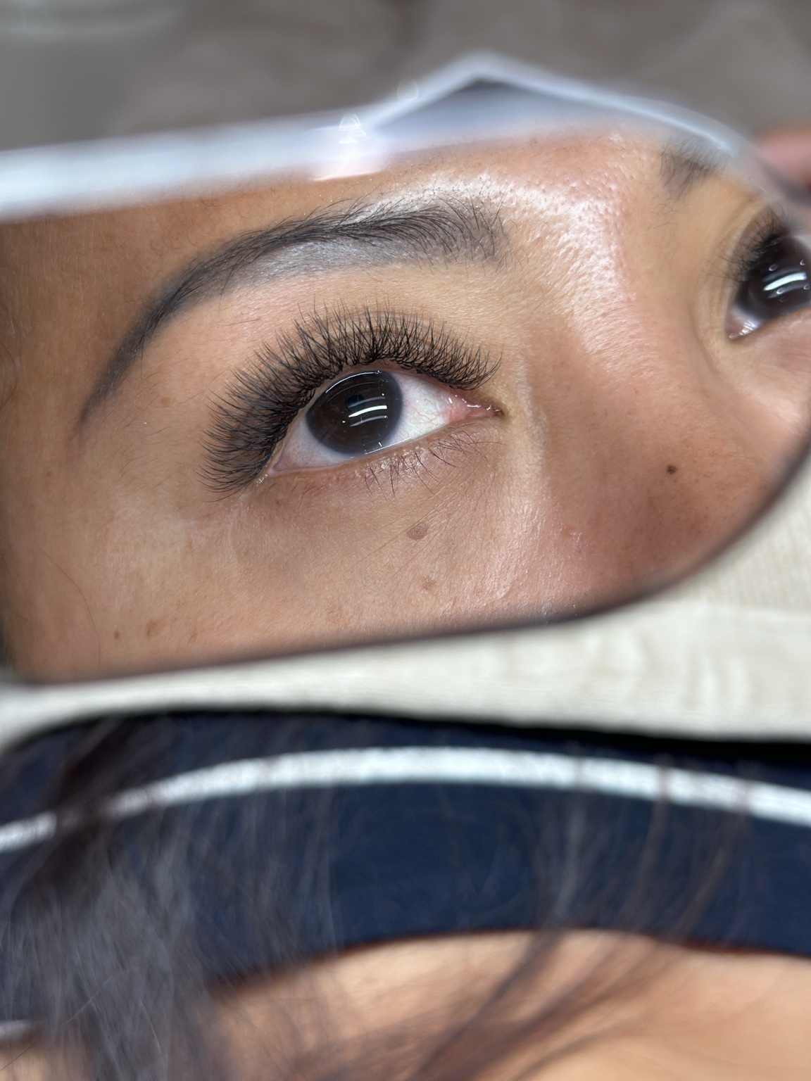 An upward view of eyelash extensions
